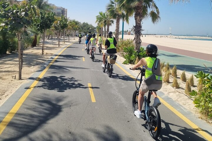 Pedal past Dubai's beautiful coastline and lush palm-lined paths. Discover hidden gems with ease as you explore the city on an electric bike enjoying every moment of the ride.